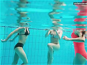 3 nude girls have fun underwater