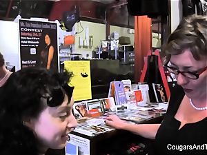 cougar plays with her stepdaughter's muff in the shop
