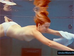 ginger-haired in a white sundress and jaw-dropping bathing suit
